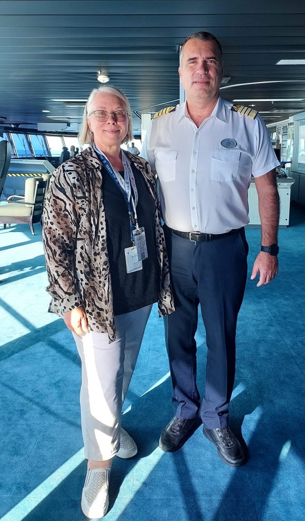 Leah on Cruise Ship Bridge with ship captain